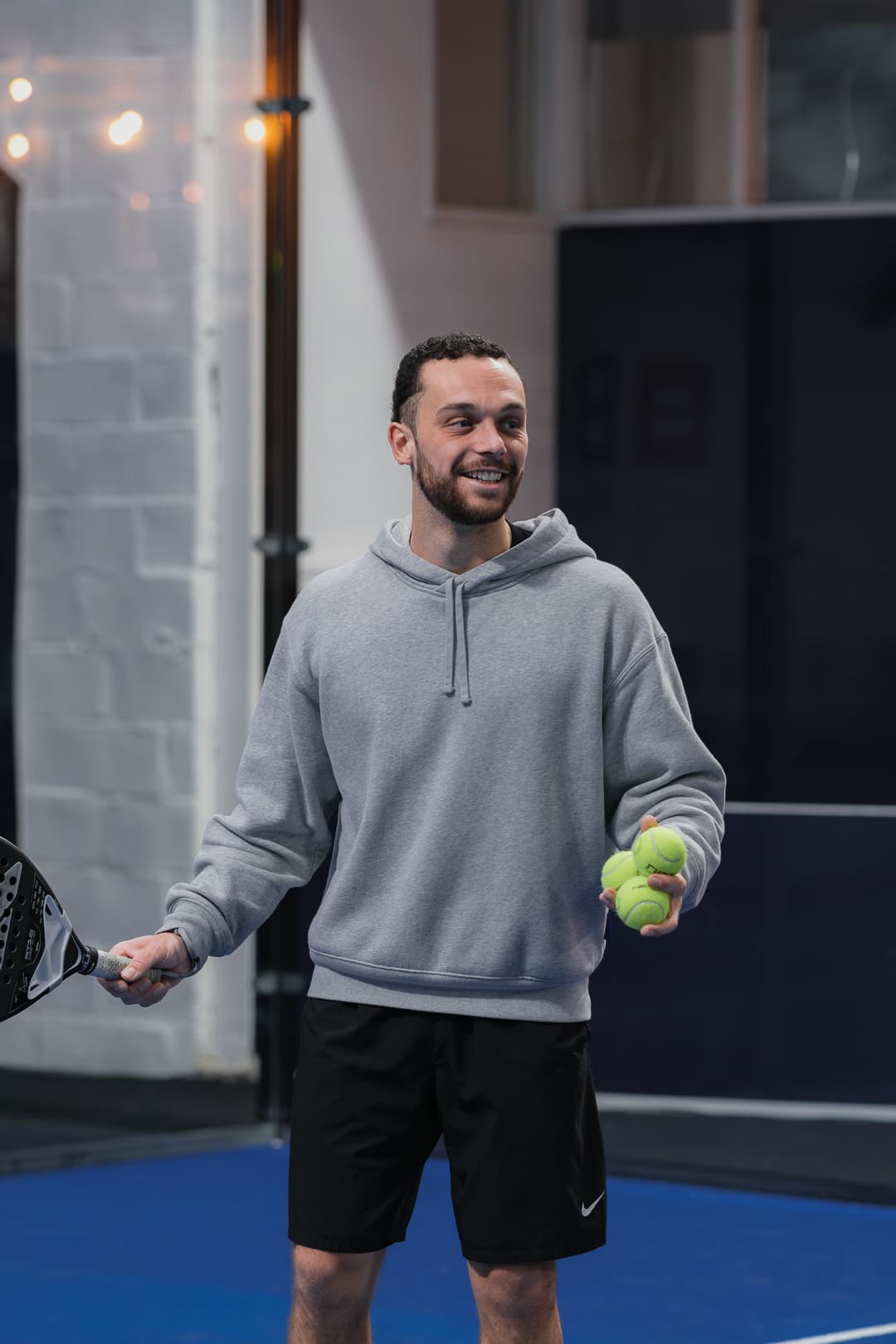 Kevin Padel with padel balls on court